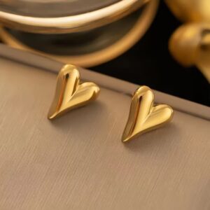 Puffy heart stud earrings Gold heart stud earrings Domed heart earrings Chunky gold heart studs Sculptural stud earrings Gold plated stud earrings Minimalist heart jewelry Modern romantic earrings Dainty gold earrings Everyday ear stack Valentine's Day gift